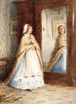 A young girl looking in the mirror